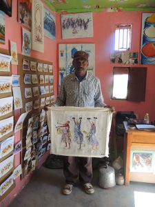 A painter selling his paintings near Kasbah Aït Benhaddou, Morocco